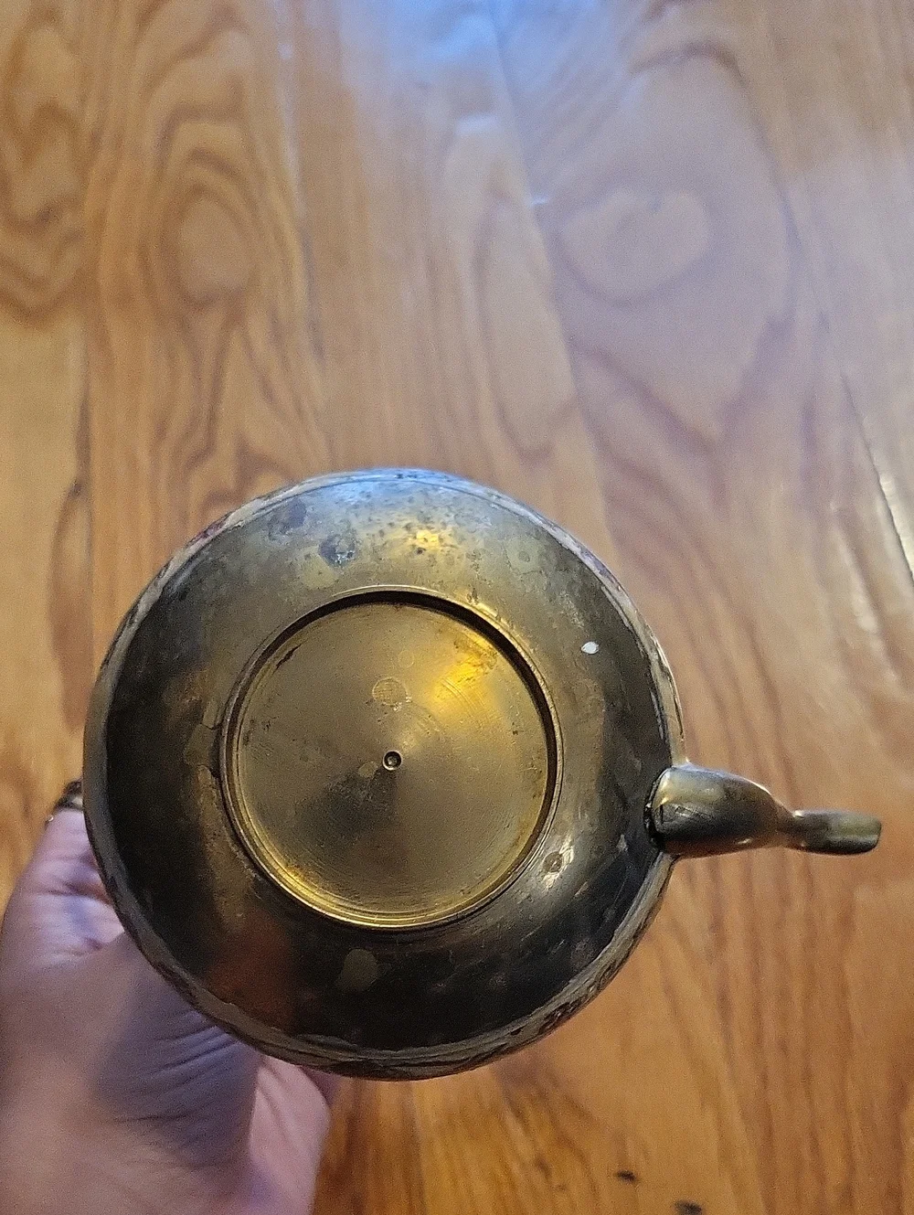 Ornate Brown Metal Teapot with Wooden Handle